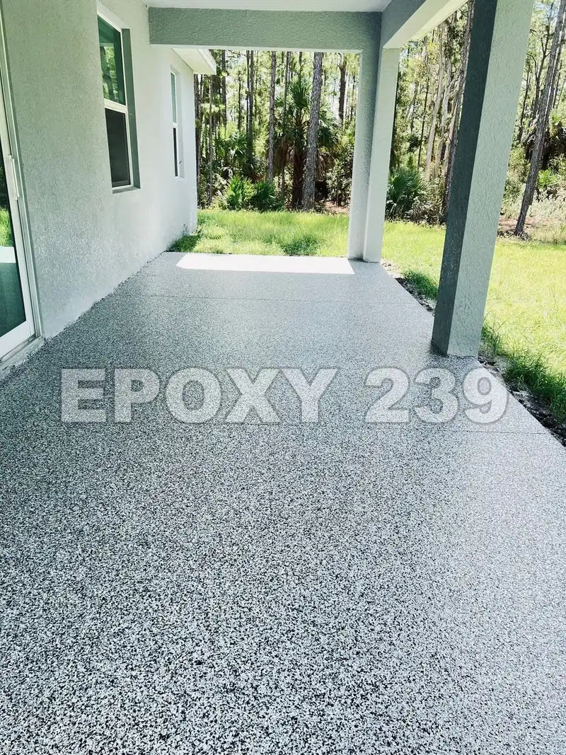 Covered lanai opening onto the lawn, coated in Domino flake epoxy